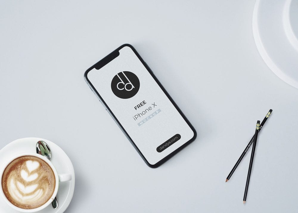free iphone x on table mockup psd