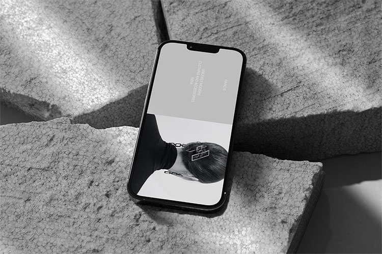 Free iPhone 13 Pro on Stone Surface Mockup